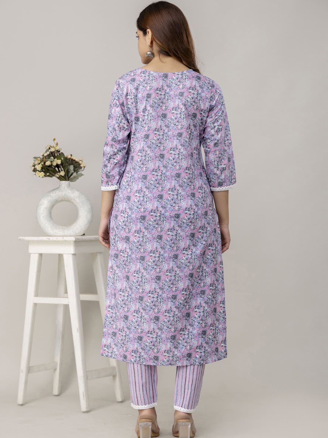 Lavender floral cotton kurta with matching striped pants, perfect for daily wear and casual occasion.